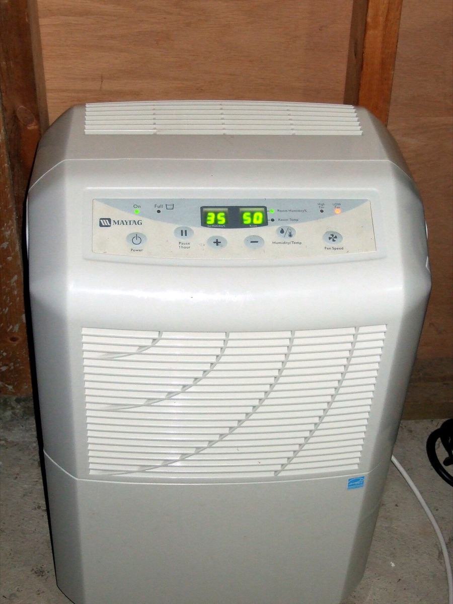 A portable dehumidifier with a digital humidity display